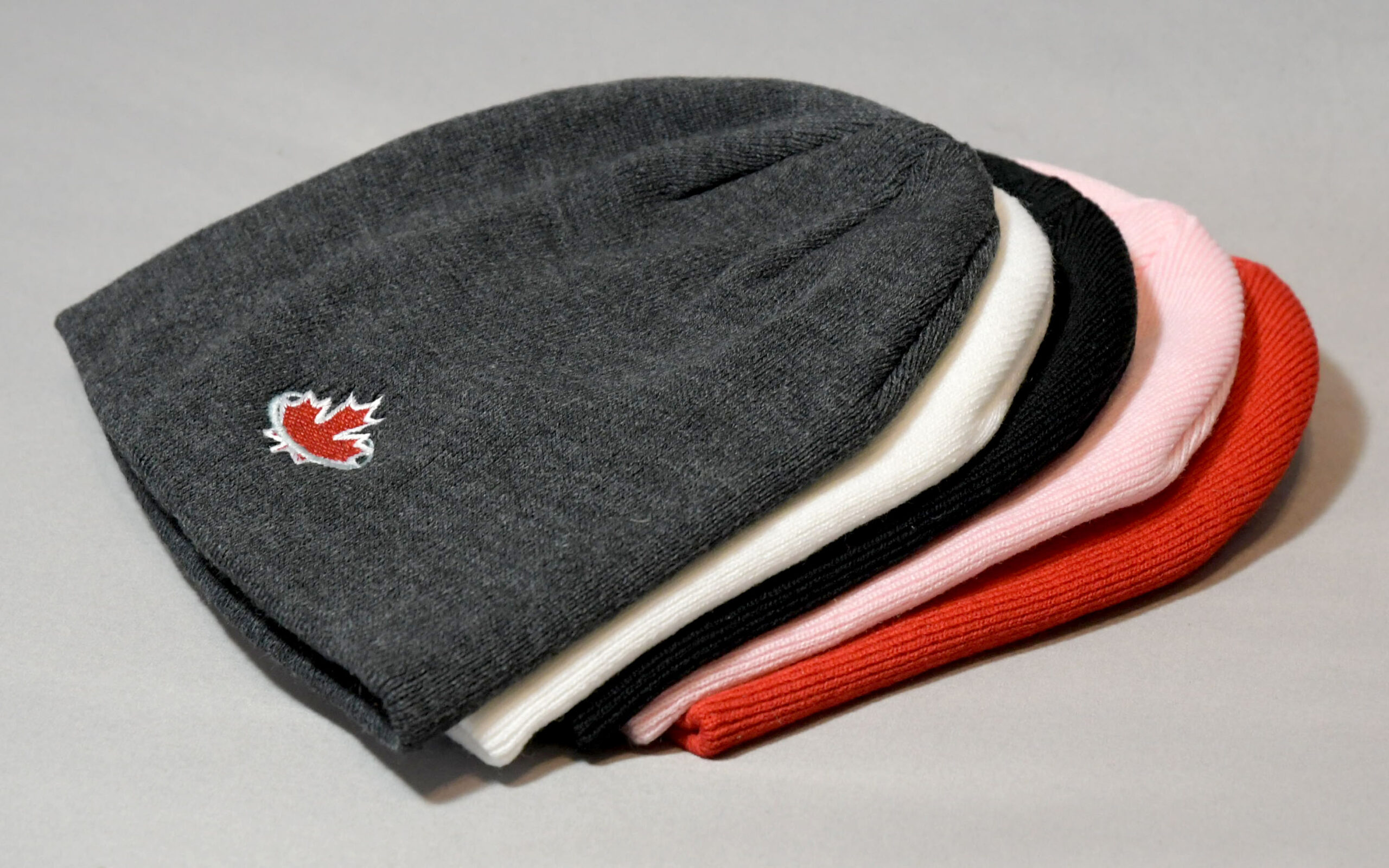 Grey, white, black, pink and red Toques