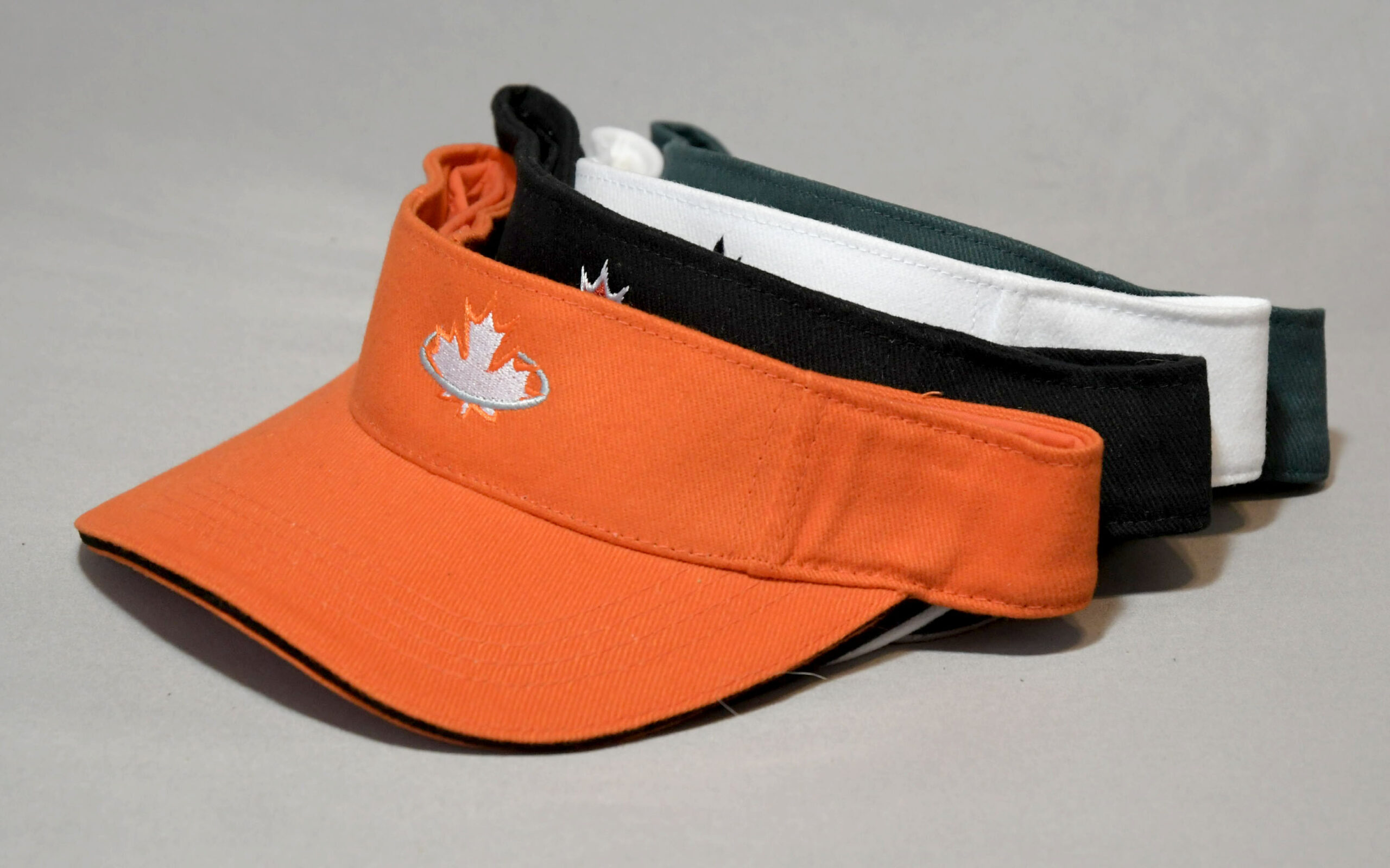 Orange, black, white and green visors